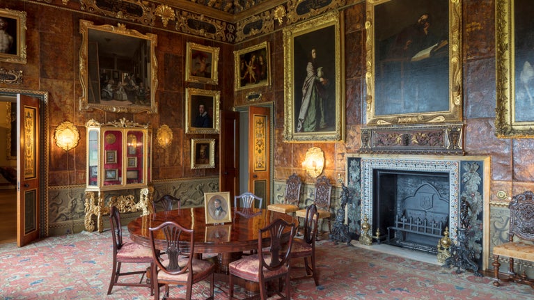 A magnificent interior, with pictures and mahogany furniture